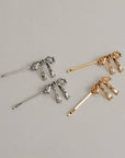 Ensemble de 2 Barrettes Bobby Pins Boucles Nar'sha Dorées - Ex - voto
